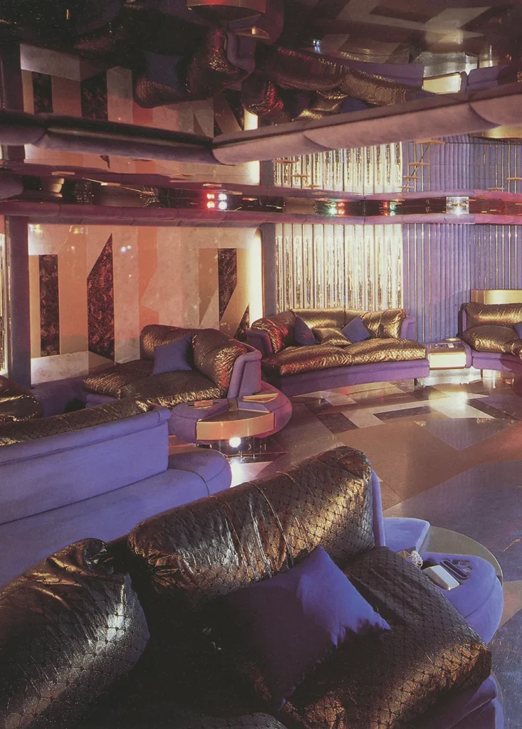 Interior view of the disco lounge aboard Trump Princess, featuring mirrored ceilings, plush seating, and dramatic lighting