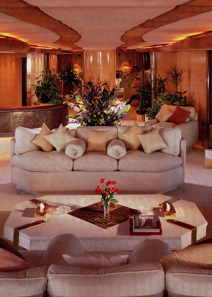 The Sapphire Suite aboard Trump Princess showing curved cabinetry, marble finishes, and mirrored walls